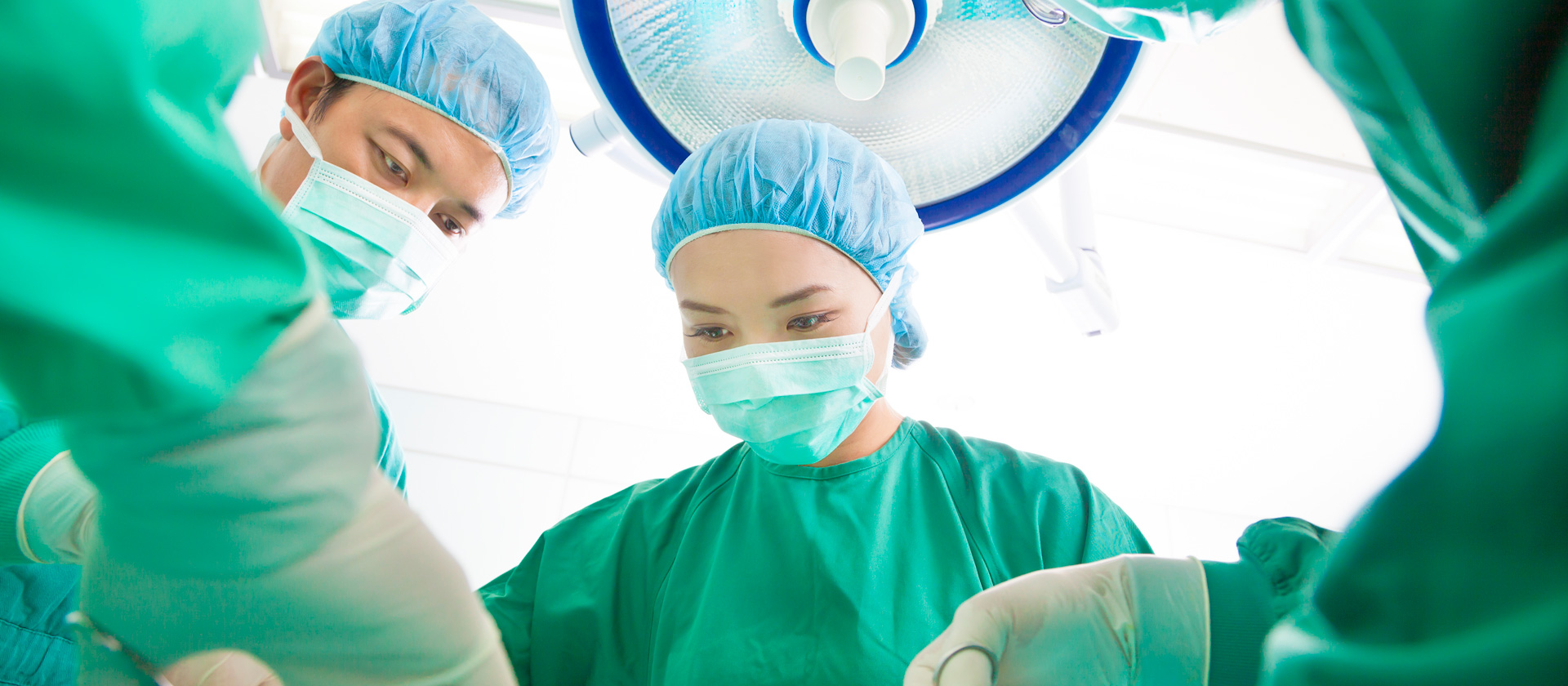surgeons in scrubs operating
