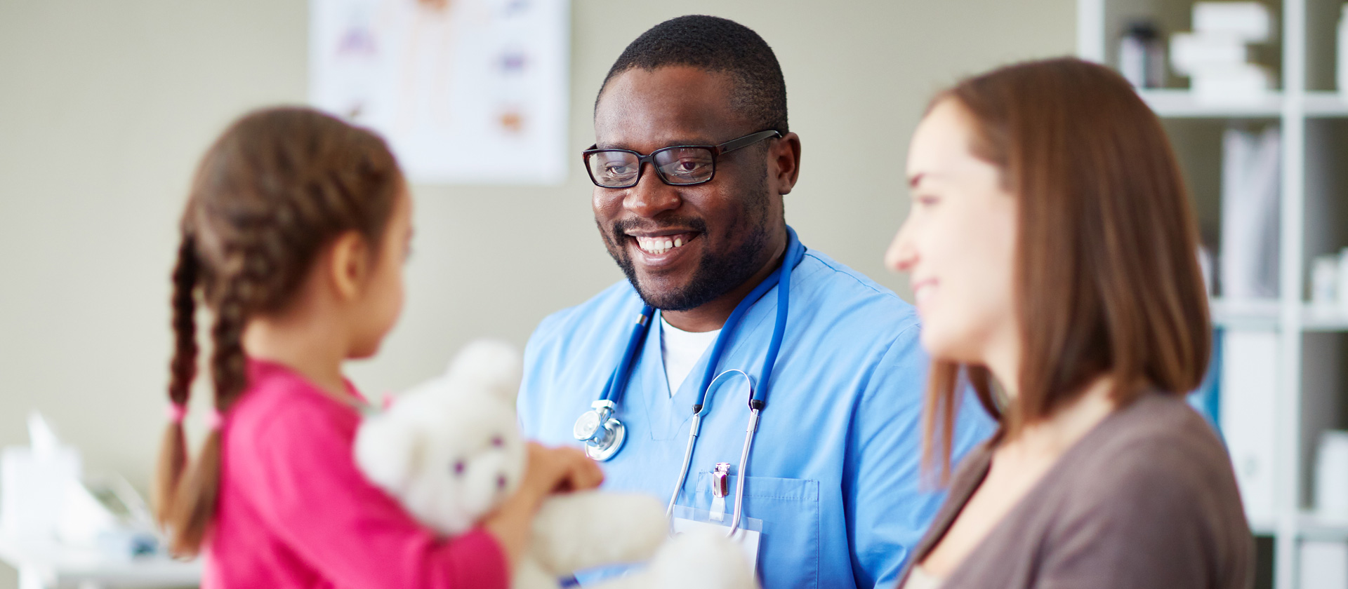 clinician with caregiver and child