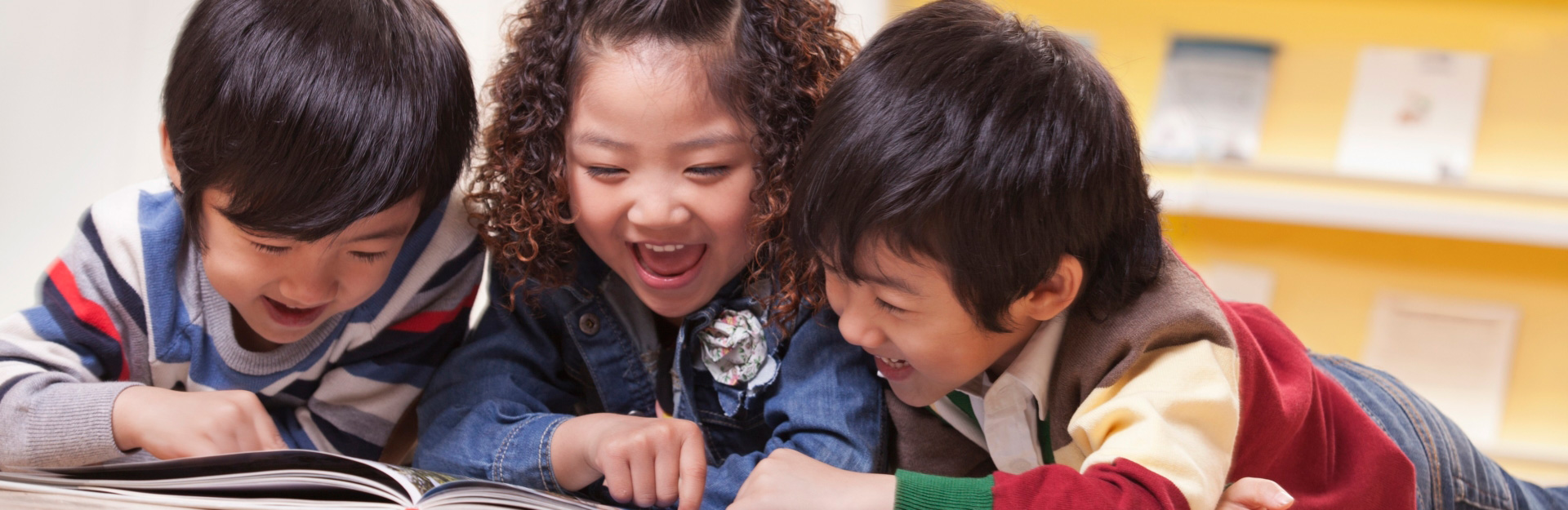 three children smiling together