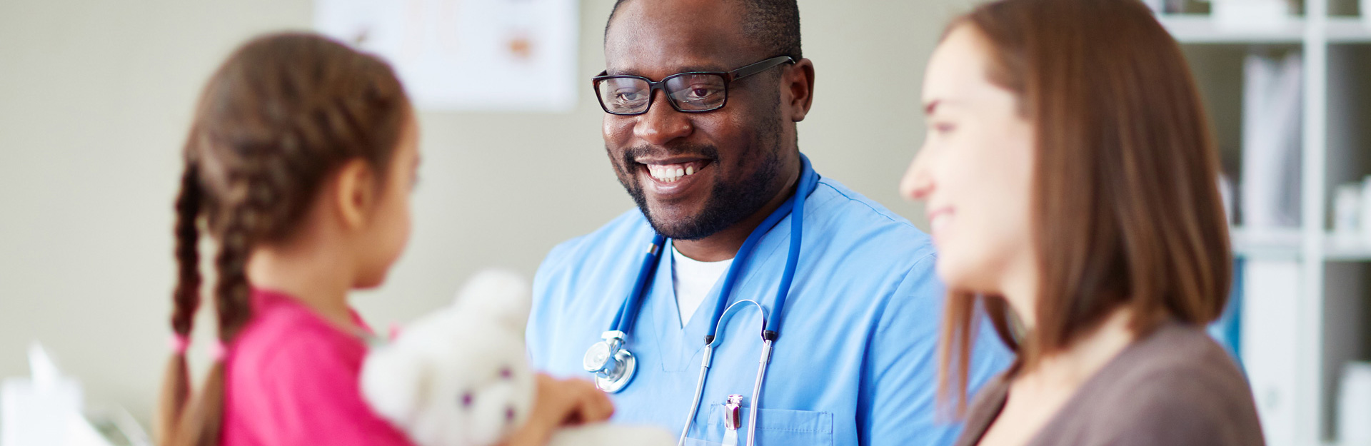 clinician with caregiver and child